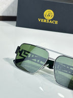 Versace sunglasses with silver frames and green mirrored lenses