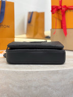 Louis Vuitton black monogram crossbody bag, side profile with flat zip top