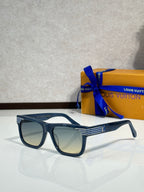 Dark blue rectangular eyeglasses with tinted lenses and LV logo at the temple.