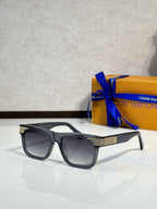 Black rectangular eyeglasses with tinted lenses and LV logo detail on the temple.