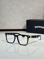 Black eyeglasses with dark blue lens tint and gold-tone bridge accents