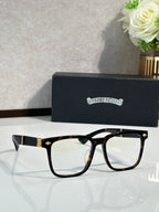 Tortoiseshell eyeglasses with clear lenses and gold-tone metal bridge
