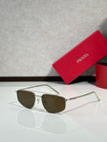 Prada aviator sunglasses with silver frame and dark brown lenses
