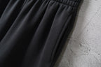 Balenciaga black pants with pleated front and tapered hem
