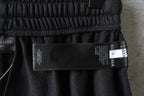 Balenciaga shorts with black care label and white size tag at waistband