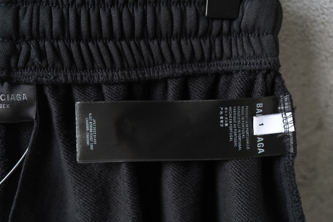 Balenciaga shorts with black care label and white size tag at waistband