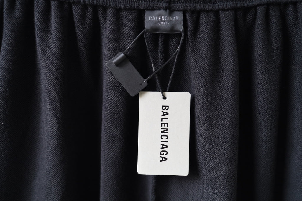 Balenciaga pants with hanging brand tag and care label