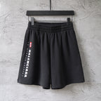 Balenciaga black shorts with wide elastic waistband and side logo print