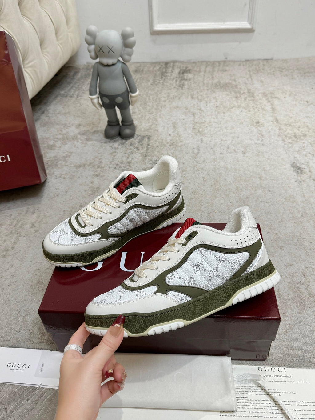 Pair of Gucci unisex sneakers on box: white leather, olive trim, red and green accents