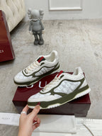 Gucci unisex sneakers, white uppers and olive-green side panels with red/green tabs.