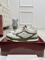 Gucci unisex sneakers on box, white and olive-green with red/green logo heel patch.