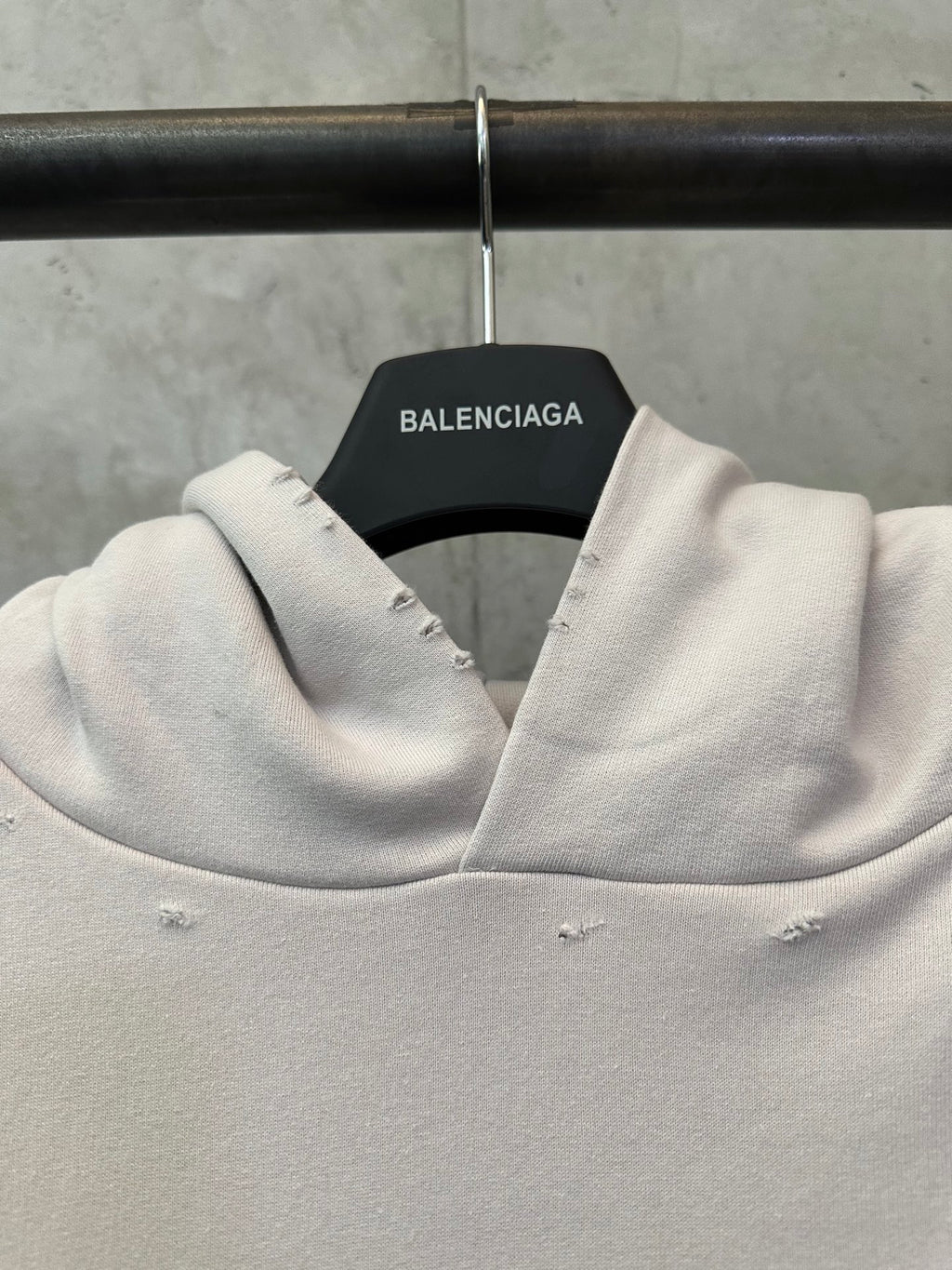 White hoodie neckline with hood and inner label reading Balenciaga