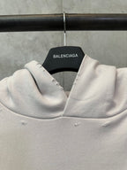 White hoodie neckline with hood and inner label reading Balenciaga