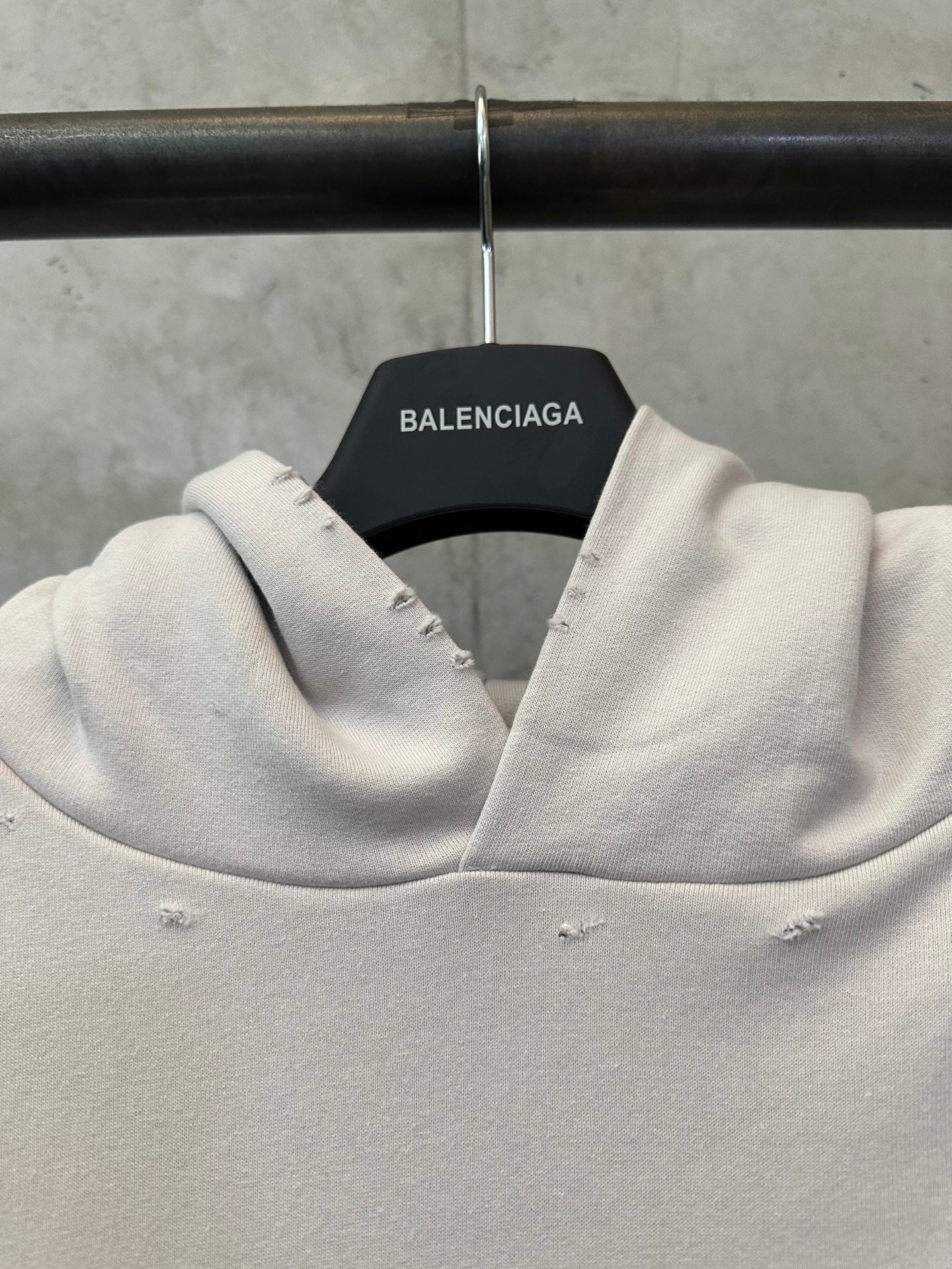 White hoodie neckline with hood and inner label reading Balenciaga