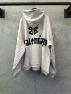 White long-sleeve hoodie with black Balenciaga logo graphic on the back