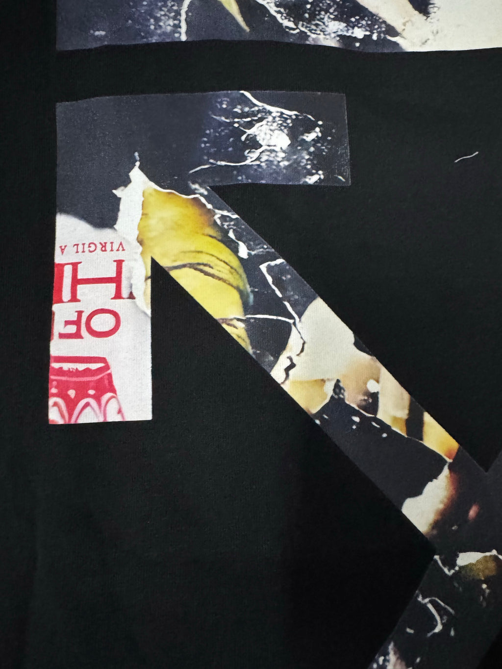 Black T-shirt close-up of back graphic artwork and red Off-White text