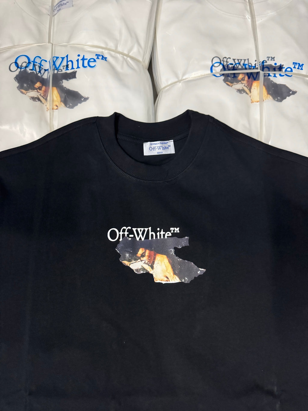 Black T-shirt showing Off-White chest logo and photo-collage graphic
