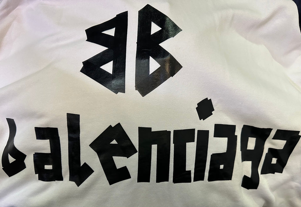 White hoodie fabric with close-up black Balenciaga logo print