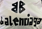 White hoodie fabric with close-up black Balenciaga logo print