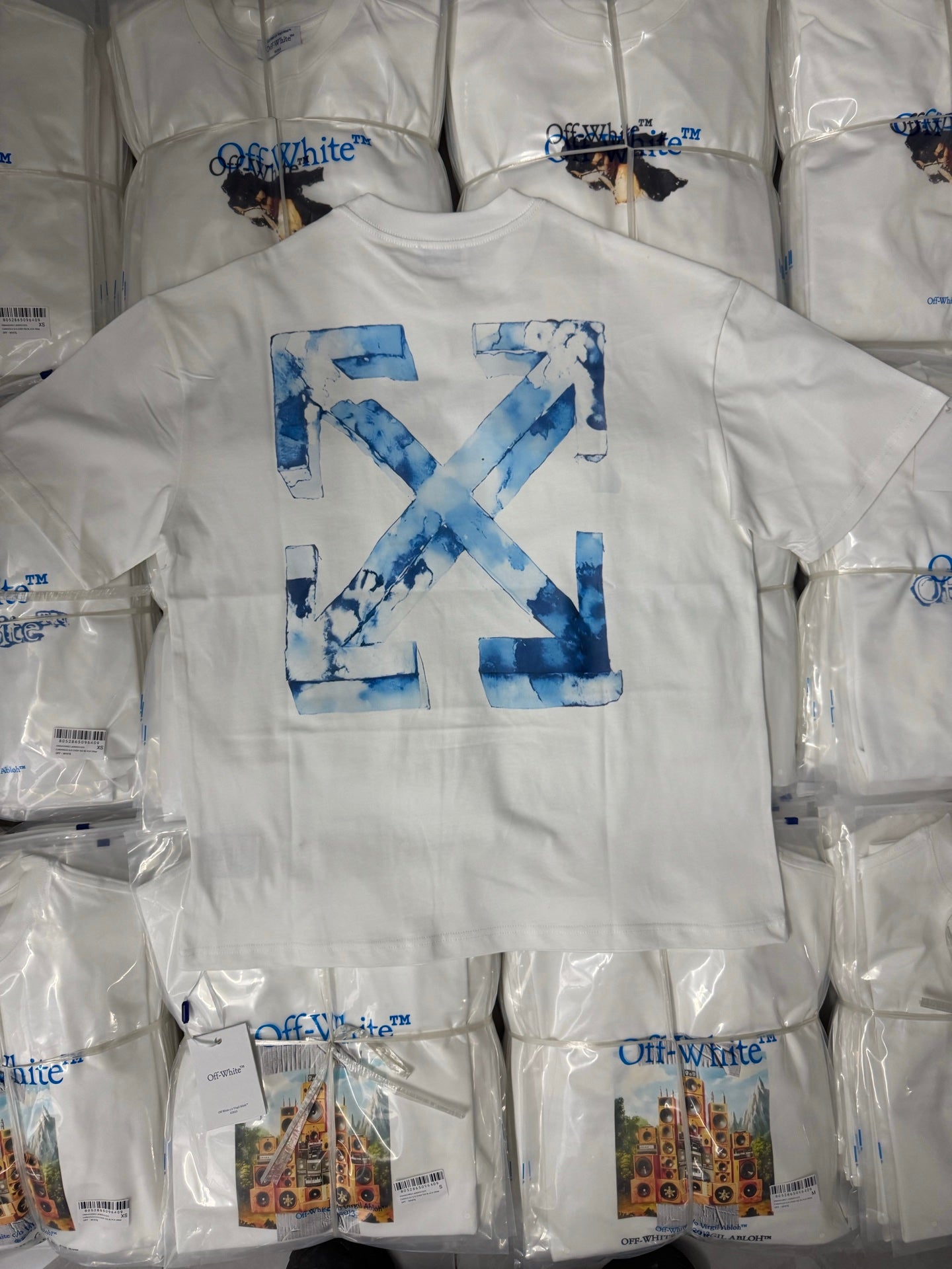 Off-White T-shirt with large blue “X” graphic on the front