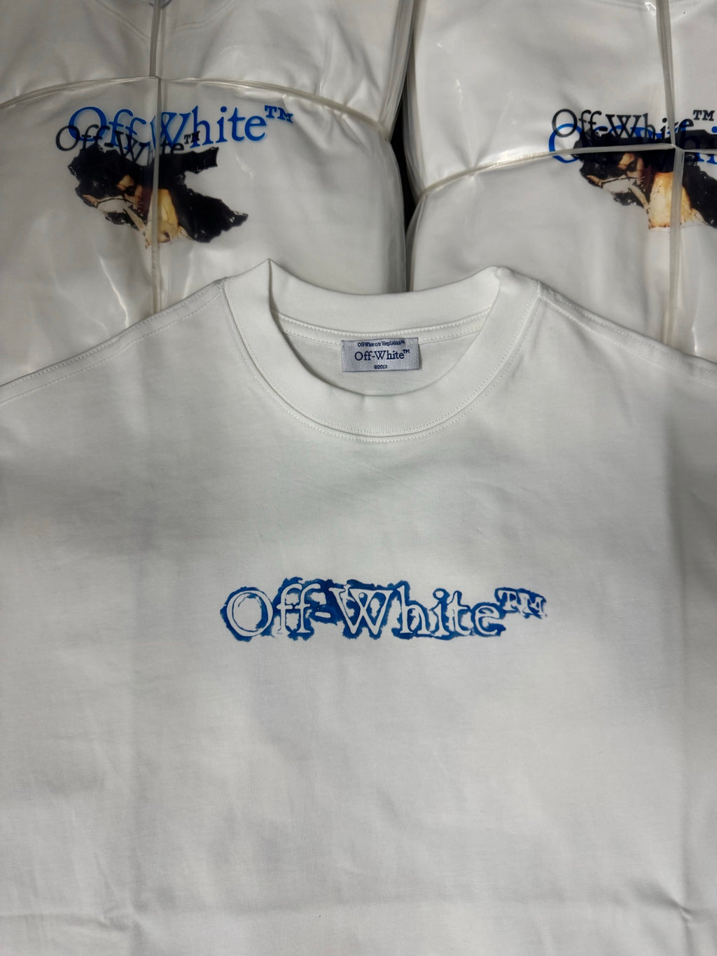 Off-White T-shirt with crew neck and blue logo print on the chest