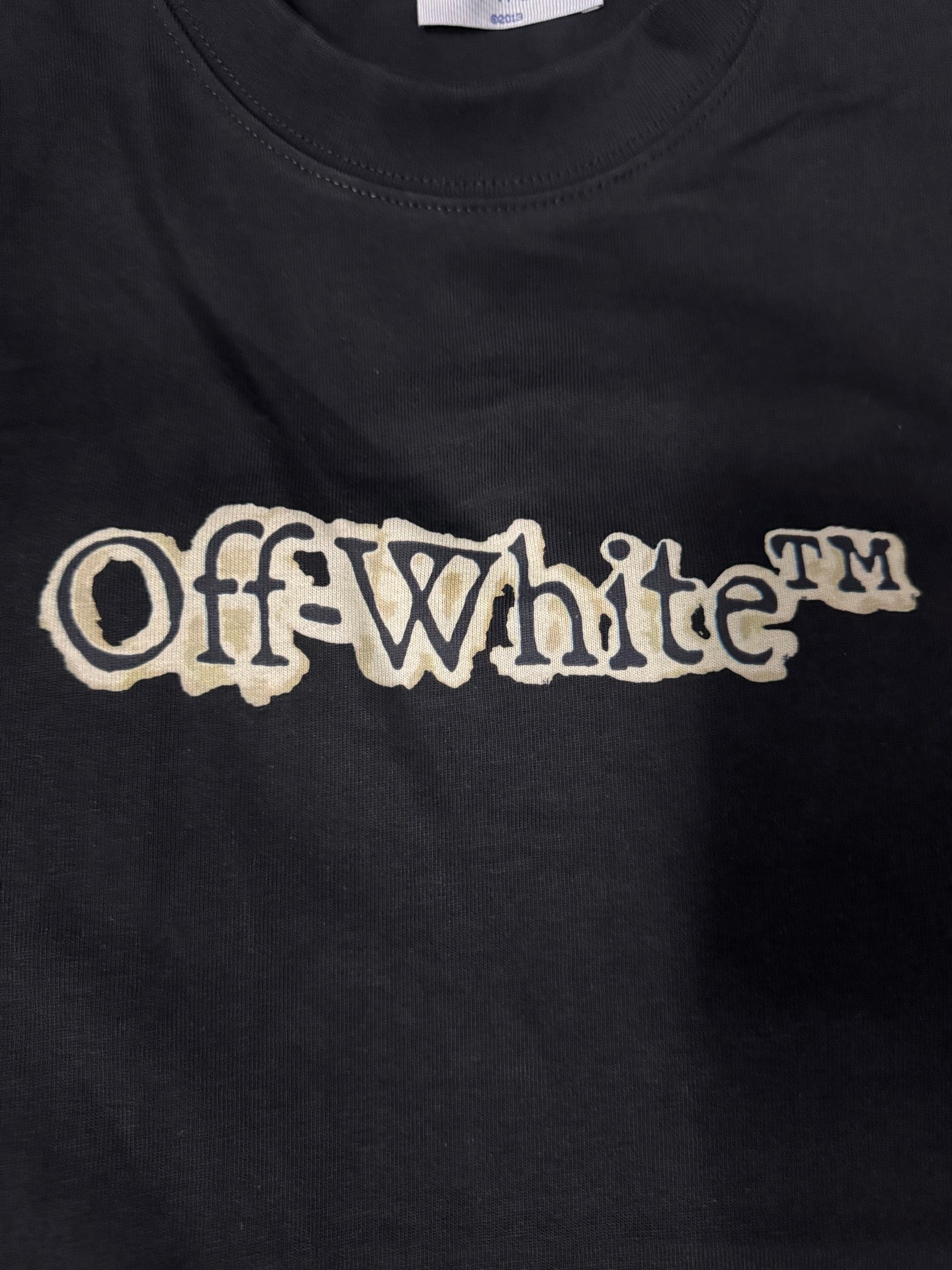 Black T-shirt featuring the Off-White logo in white lettering
