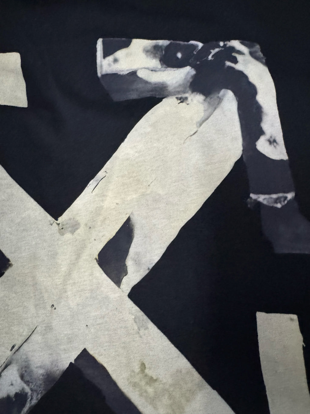 Black T-shirt close view: off-white Off-White X graphic corner