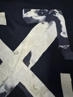 Black T-shirt close view: off-white Off-White X graphic corner