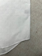Louis Vuitton white shirt hem corner with curved stitching and side seam