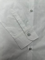 Louis Vuitton white shirt cuff and sleeve placket with round buttons and visible stitching