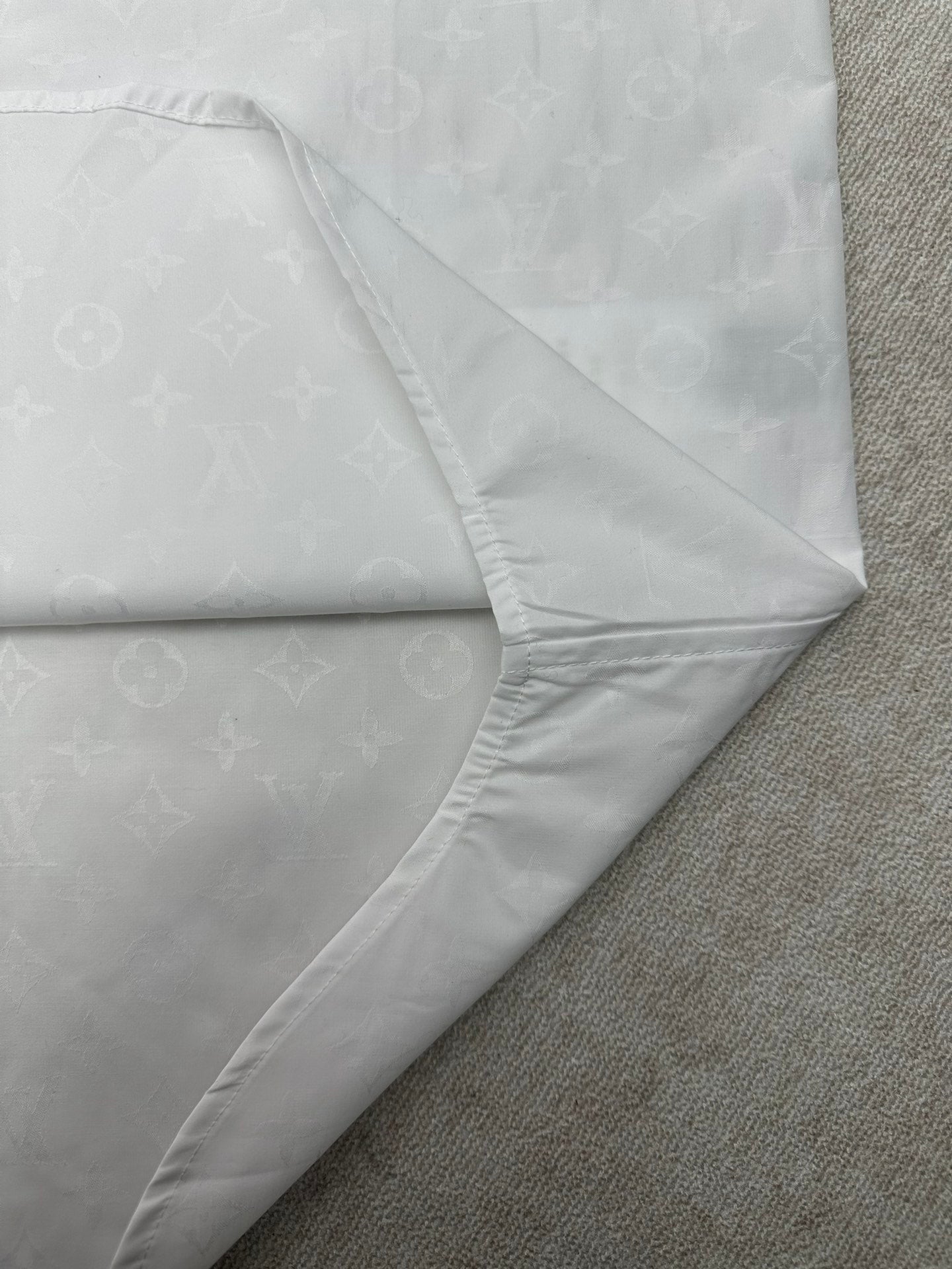 Louis Vuitton white dress shirt sleeve with diagonal seam and curved stitched hem