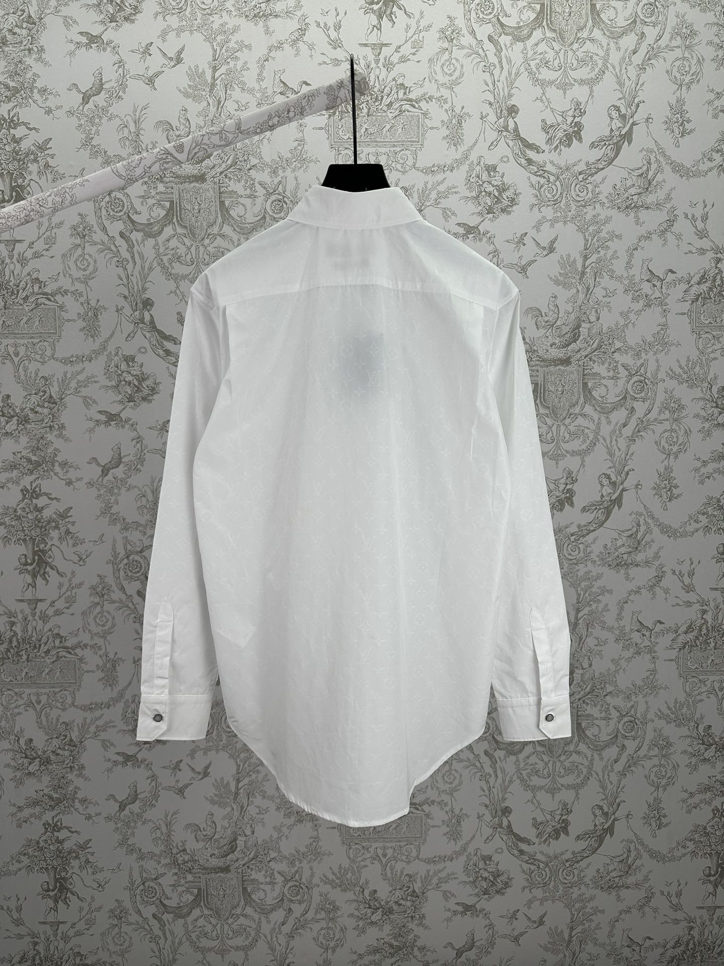 Louis Vuitton white long-sleeve button-up shirt, back view with yoke and button tabs