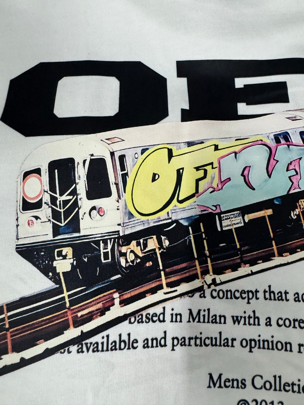 Off-White off-white T-shirt with oversized “OFF” lettering and colorful train graphic