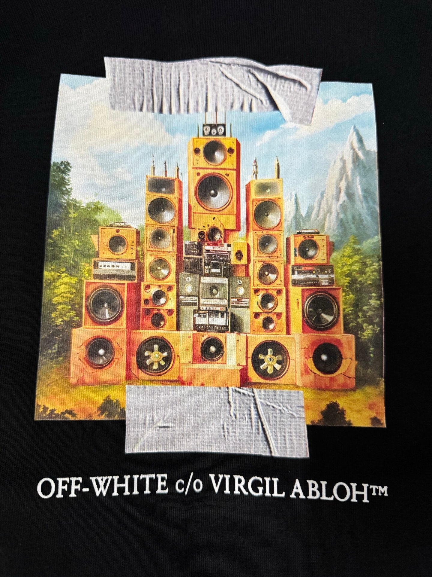 Black T-shirt with oversized speaker artwork and “c/o VIRGIL ABLOH” text