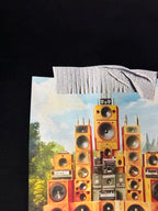 Black T-shirt close-up of speaker graphic with mountains background artwork