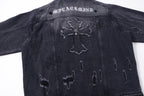Dark denim jacket back with large cross emblem and worn embroidery