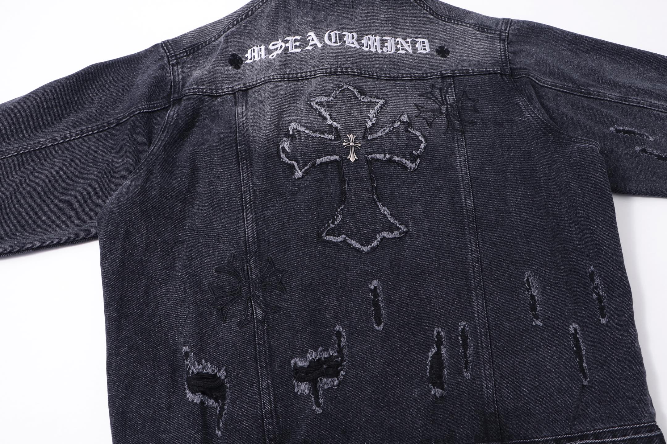 Dark denim jacket back with large cross emblem and worn embroidery