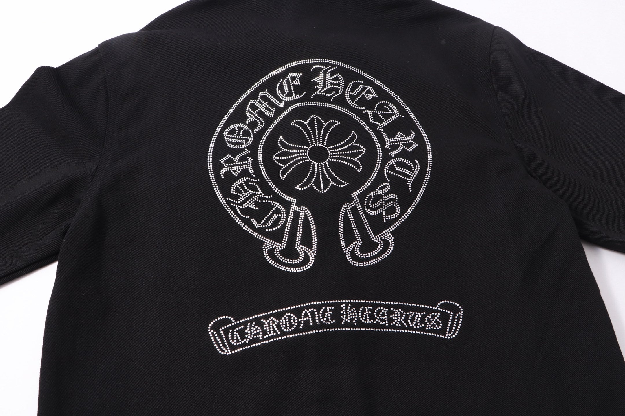 Black shirt jacket back with white rhinestone tree-of-life emblem and banner