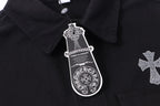 Black shirt jacket collar with metallic button and hanging brand tag