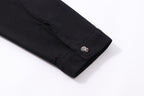Black long-sleeve shirt jacket cuff with metallic button