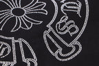 Black fabric with white rhinestone swirl and star cross decoration