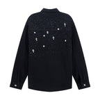 Black long-sleeve button-up shirt, back view with white star and cross pattern.