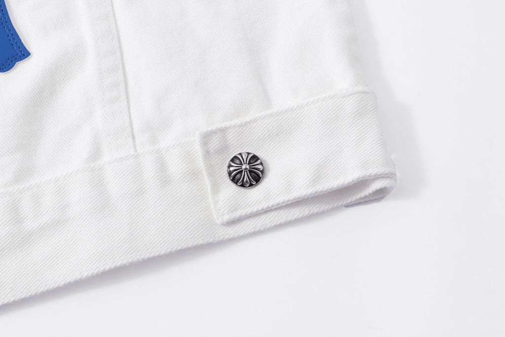 White jacket hem with small metal button and reinforced fabric stitching