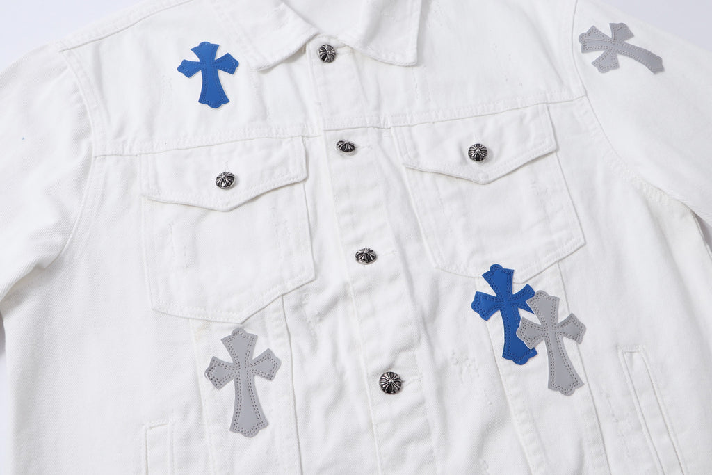 White long-sleeve jacket with multiple blue and gray cross patches and front button closures