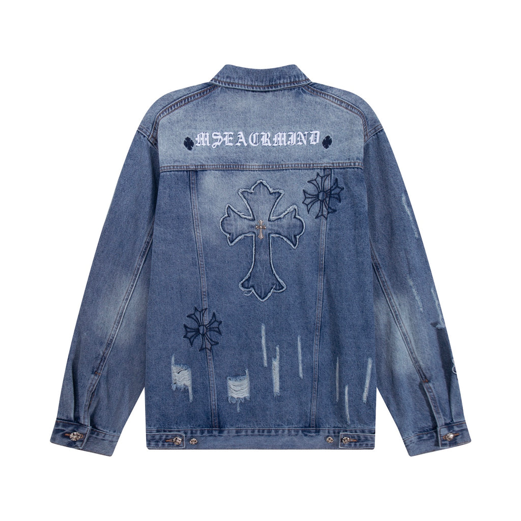 Blue denim jacket back panel with large cross and small floral patches
