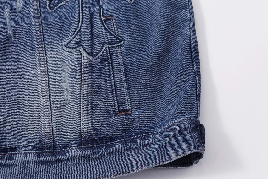 Blue denim jacket lower front with button placket and embroidered cross
