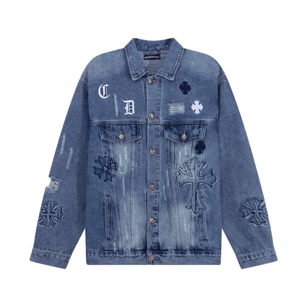 Blue denim jacket with button front and cross patch graphic on chest
