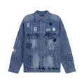 Blue denim jacket with button front and cross patch graphic on chest