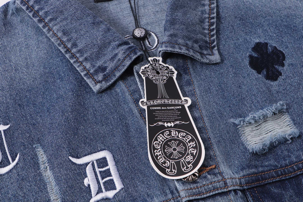 Blue denim jacket close-up of button placket and crest patch