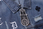 Blue denim jacket close-up of button placket and crest patch